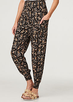 Multi Black Printed Relaxed Tapered Harem Pants by Izabel London