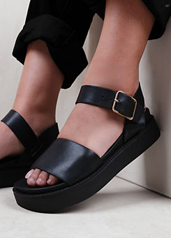 Phoenix Black Wide Fit Buckle Flat Sandals by Where’s That From