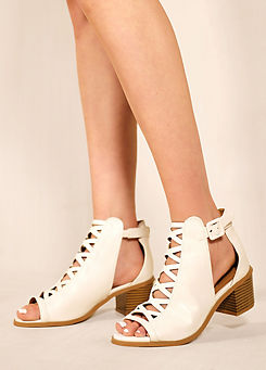Reydah White Suede Peep Toe Block Heel Sandals by Where’s That From