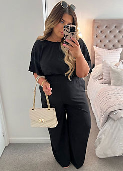 X Black Wide Leg Elasticated Jumpsuit by In The Style